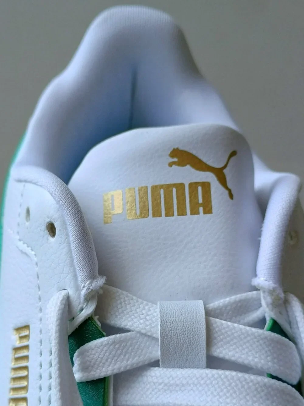 Puma Men's Shuffle Downtown Leather Sneaker in White / Emerald / Ice / Puma Gold